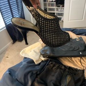 Giuseppe Zanotti black fishnet peep toe sandal.